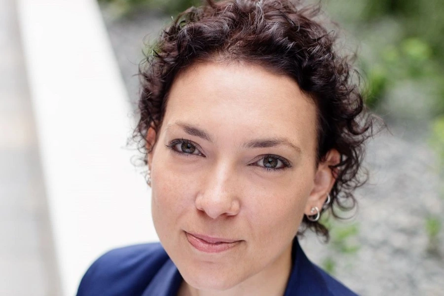 young woman with short hair looking up